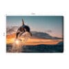 Obraz na płótnie Natura Skaczące orki nad oceanem o zachodzie Premium Canvas